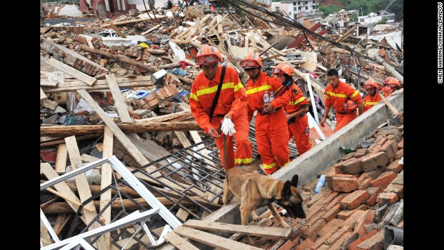 Rescuers search for survivors August 4 in the ruins of Longtoushan. Hundreds of aftershocks have been recorded since the first tremor.