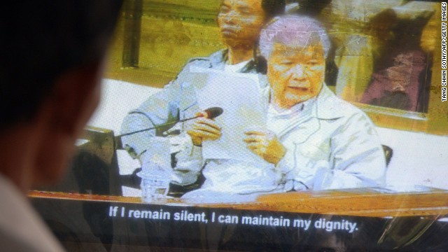  A Cambodian man Khieu Samphan on a television during the trial at the Extraordinary Chamber in the Courts of Cambodia (ECCC) in Phnom Penh on August 7. He and Nuon Chea were found guilty of crimes against humanity and sentenced to life in prison.