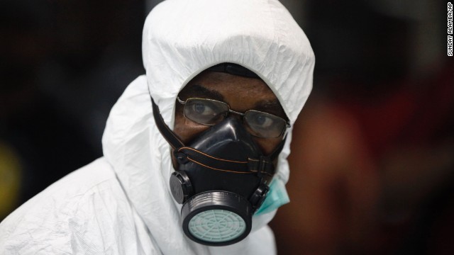 A Nigerian health official wears protective gear August 6 at Murtala Muhammed International Airport in Lagos.