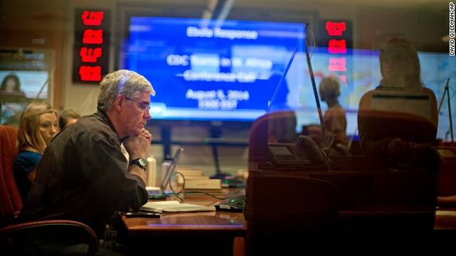 Officials with the Centers for Disease Control and Prevention in Atlanta sit in on a conference call about Ebola with CDC team members deployed in West Africa on Tuesday, August 5.