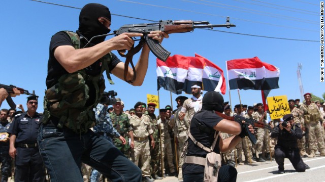 Iraqi Shiite volunteers who have joined government forces to fight ISIS take part in a training session near Basra, Iraq, on Thursday, August 7. 