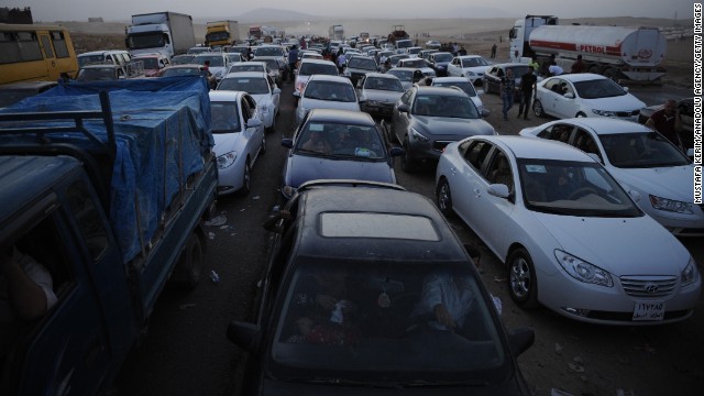 Thousands of Yazidi and Christian people flee Mosul on Wednesday, August 6, after the latest wave of ISIS advances.