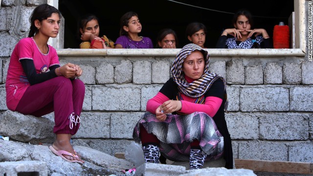 Yazidi women who fled violence in Sinjar, Iraq, take shelter at a school in Dohuk on August 5.