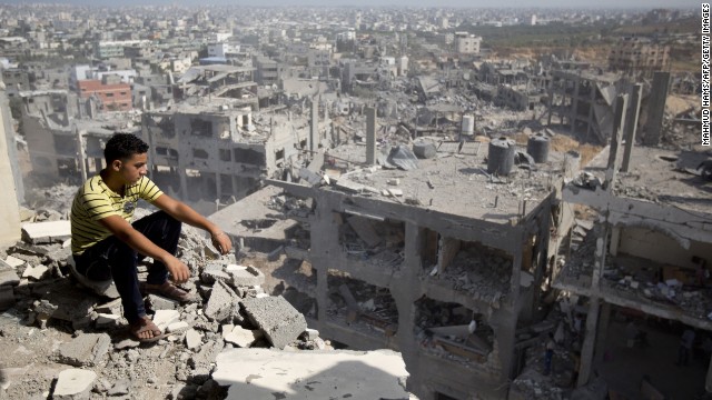 A Palestinian man looks out over destruction in the al-Tufah neighborhood of Gaza City on Wednesday, August 6. 