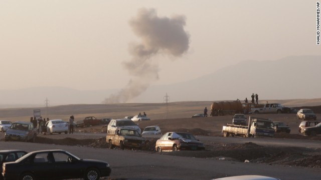 Smoke rises after airstrikes targeted ISIS militants outside the Iraqi city of Irbil on Friday, August 8.