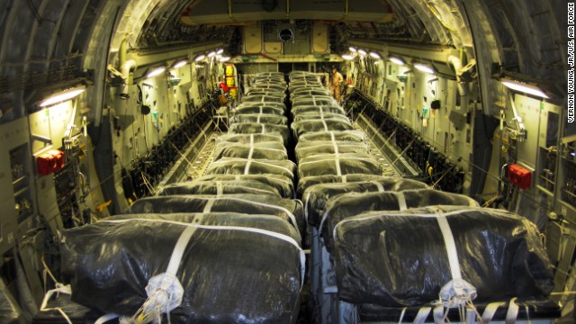 Pallets of bottled water are loaded aboard a U.S. Air Force aircraft in preparation for a humanitarian airdrop over Iraq on August 8.