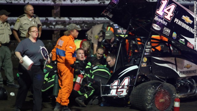 Personnel prepare to load Stewart into an ambulance after he was involved in a four-car wreck at Southern Iowa Speedway in Oskaloosa, Iowa. Stewart underwent successful surgery Tuesday, August 6, 2013, to repair the broken right tibia and fibula suffered in the wreck.