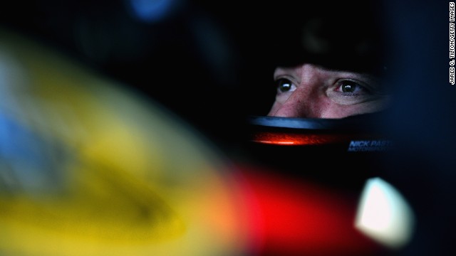 Stewart sits in his car during practice for the NASCAR Sprint Cup Series Camping World RV Sales 301 at New Hampshire Motor Speedway on July 12, 2013, in Loudon, New Hampshire. 