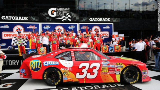  Stewart poses in the victory lane after winning the NASCAR Nationwide Series DRIVE4COPD 300 at Daytona International Speedway on February 23, 2013, in Daytona Beach, Florida. 