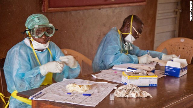 Health care workers wear protective gear at the Kenema Government Hospital on August 9.