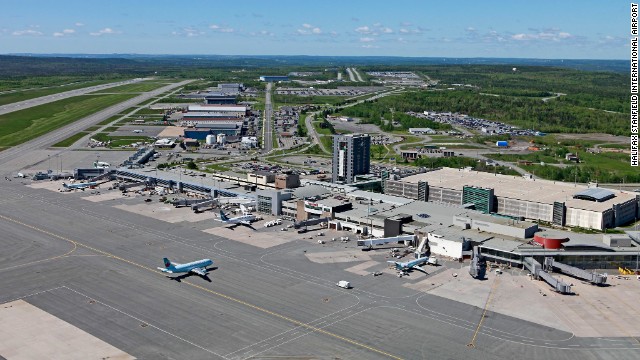 The Halifax Stanfield International Airport in Nova Scotia, Canada, is reviewing security measures after a woman climbed over a security fence on Sunday, officials say.