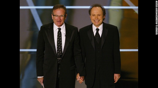 Williams and Oscar host Billy Crystal perform at the 76th Academy Awards show in 2004. 