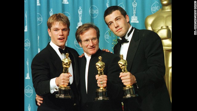 Actor-writers Matt Damon, left, and Ben Affleck, right, pose with Williams, holding the Oscars they won for "Good Will Hunting" at the 70th annual Academy Awards in 1998. Damon and Affleck won for best original screenplay, and Williams won for best supporting actor.