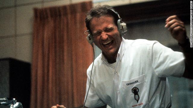 Williams enjoys music through a headset in a scene from the film "Good Morning, Vietnam" in 1987.