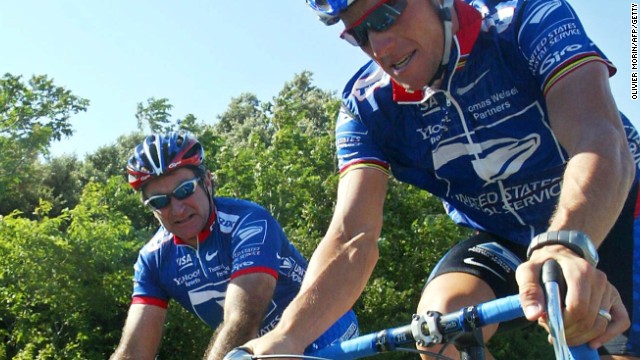 Williams shares a moment with Armstrong during a rest day at the 2002 Tour de France. The pair were personal friends.