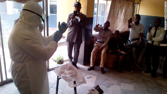 A member of the Centers for Disease Control and Prevention leads a training session on Ebola infection control Monday, August 11, in Lagos, Nigeria.