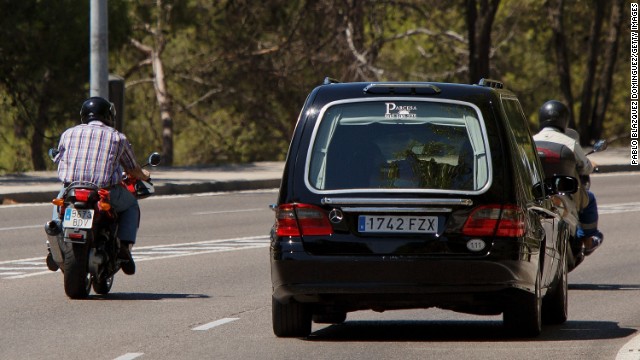 A hearse carries the coffin of Spanish priest Miguel Pajares after he died at a Madrid hospital on Tuesday, August 12. Pajares, 75, contracted Ebola while he was working as a missionary in Liberia.