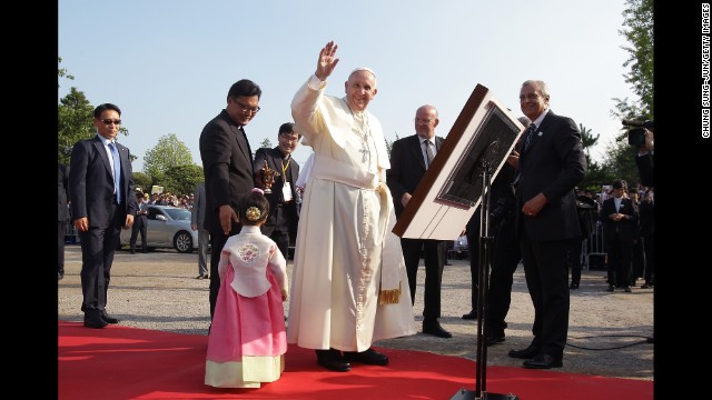 Pope Francis waves to a crowd during his visit to the birthplace of Saint Kim Taegon Andrea, who was the first Korean-born Catholic priest and is the patron saint of Korea, at the Solmoe Shrine for Korea's Catholic martyrs on August 15.