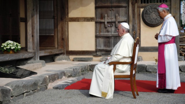 Pope Francis prays with Daejeon Bishop Lazarus You Heung-sik in front of the birthplace of Saint Andrea Kim Dae-gun in Dangjin.
