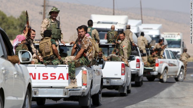 Trucks carrying Kurdish Peshmerga fighters head to the Mosul Dam on August 17. 