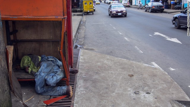 A body, reportedly a victim of Ebola, lies on a street corner in Monrovia on Saturday, August 16. 