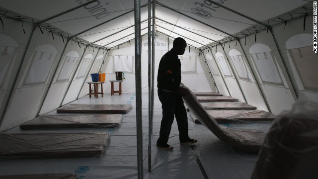 Workers prepare the new Ebola treatment center on August 17.