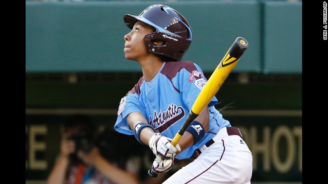 Davis also contributes to the batting lineup. Here, she drives in a run with a single to right field during a Sunday, August 17, match against Pearland, Texas.