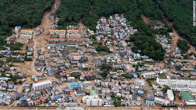 This aerial view shows the damage caused by a landslide after heavy rains hit the city of Hiroshima, western Japan, on August 20, 2014.