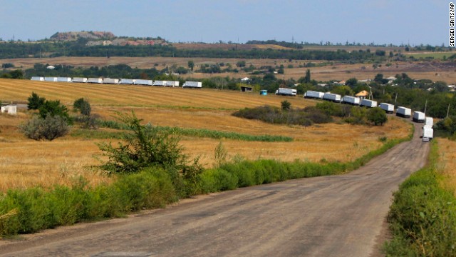 The first trucks of a Russian aid convoy roll on the main road to Luhansk in eastern Ukraine on Friday, August 22. The head of Ukraine's security service called the convoy a "direct invasion" under the guise of humanitarian aid since it entered the country without Red Cross monitors. 