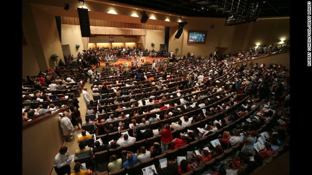 Mourners fill the pews for the funeral service at Friendly Temple Missionary Baptist Church in St. Louis.