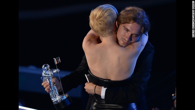 Cyrus and Helt embrace following his acceptance speech given on behalf of the singer who won Video of the Year for "Wrecking Ball" during the 2014 MTV Video Music Awards. 