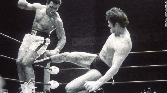 Former Japanese wrestler turned politician Kanji "Antonio" Inoki strikes out at Muhammad Ali during an exhibition fight in Tokyo, July 5, 1976.