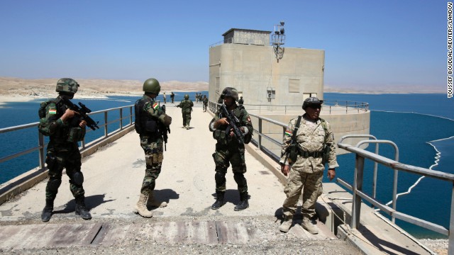 Peshmerga fighters stand guard at Mosul Dam in northern Iraq on Thursday, August 21. With the help of U.S. military airstrikes, Kurdish and Iraqi forces retook the dam from ISIS militants on August 18. A breach of the dam would have been catastrophic for millions of Iraqis who live downstream from it.