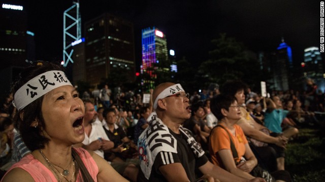 Protesters rally for the pro-democracy Occupy Central movement outside government offices in Hong Kong Sunday.