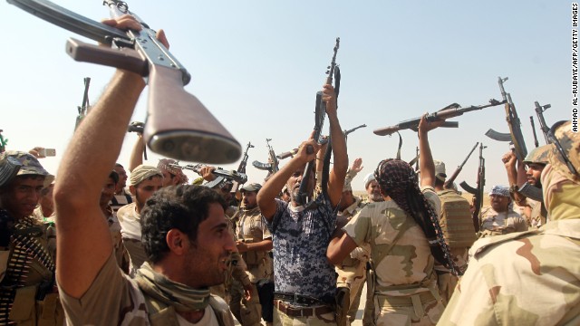 Iraqi volunteer fighters on Monday, September 1, celebrate breaking the siege of the Shiite town of Amerli. ISIS militants had surrounded Amerli, 70 miles north of Baquba, since mid-June.