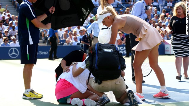 Caroline Wozniacki consoles Peng Shuai, who was forced to retire in the U.S. Open semifinals Friday. 