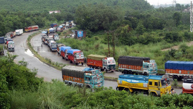 Trucks stranded by flash flooding wait for the Jammu-Srinagar national highway to open on the outskirts of Jammu, India, on September 5. 