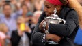 Serena Williams of the US holds the US Open trophy after defeating Caroline Wozniacki of Denmark during their US Open 2014 women's singles finals match at the USTA Billie Jean King National Center September 7, 2014 in New York. AFP PHOTO/Stan HONDA (Photo credit should read STAN HONDA/AFP/Getty Images)