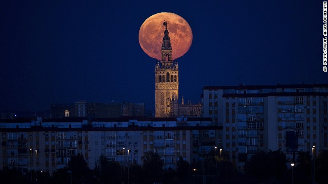SEPTEMBER 10 - SEVILLE, SPAIN: The moon rises over the Giralda, the tower of Seville's Cathedral, on September 9. This will be the third and final 