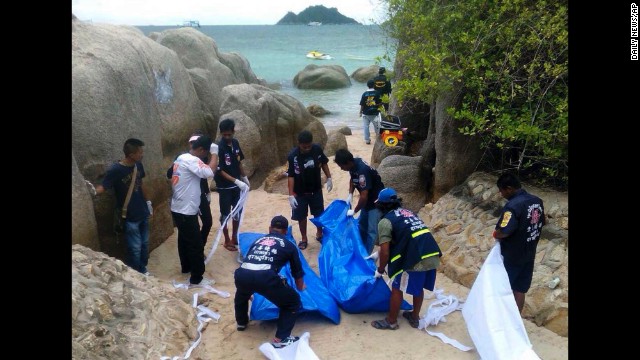 Thai police work near the bodies of two British tourists on a beach in the Surat Thani province of Thailand on Monday, September 15.