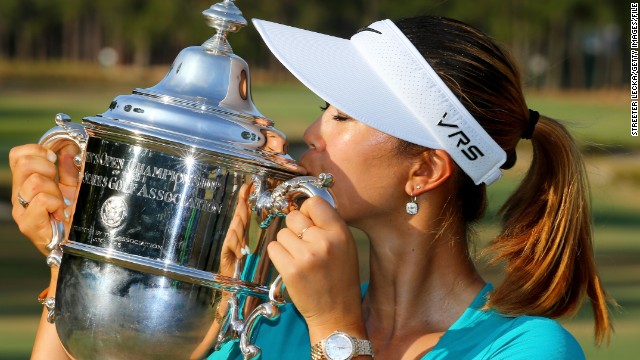 Wie kisses the trophy after finishing two shots clear of fellow American Stacy Lewis at Pinehurst in North Carolina. 
