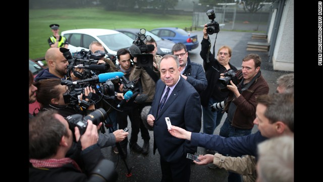 Salmond chats with reporters after casting his vote September 18 in Strichen, Scotland.