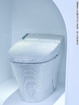 Who wouldn't want a blinged-out toilet seat? A toilet decorated with crystal rhinestones is displayed with during the 'Toilet!? Human Waste and Earth's Future' exhibition. 