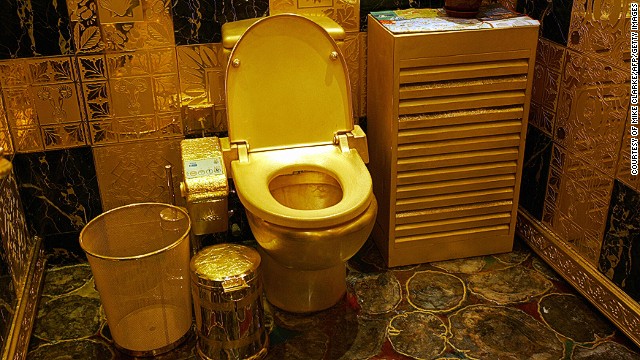 Toilets have been re-imagined in a number of outrageous ways throughout the years. This picture, taken in Hong Kong, shows a solid gold and gem-encrusted toilet valued at 38,000,000 million Hong Kong dollars (4.8 million USD). 