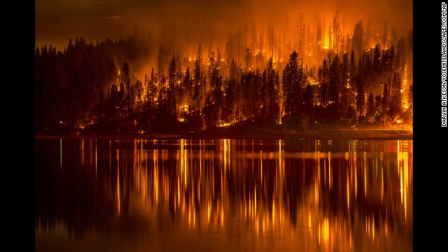 A wildfire approaches the shore of California's Bass Lake on Sunday, September 14.