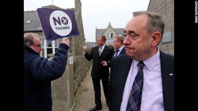 Scottish First Minister Alex Salmond passes an pro-union campaigner in Ellon, Scotland, on September 18. Salmond, leader of the independence movement, later accepted defeat and urged supporters to do the same.