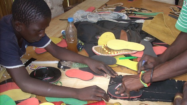 The youngsters work together to design and make the shoes at the Uganda-based center. 