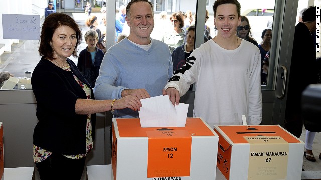 New Zealand Prime Minister John Key, his wife and son place their votes in the ballot box on September 20, 2014 in Auckland.