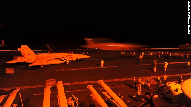 Two more U.S. fighter jets prepare to take off from the USS George H.W. Bush and conduct airstrikes against ISIS targets in Syria.
