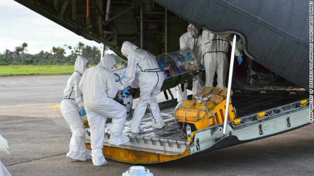Medics load an Ebola patient onto a plane at Sierra Leone's Freetown-Lungi International Airport on Monday, September 22.